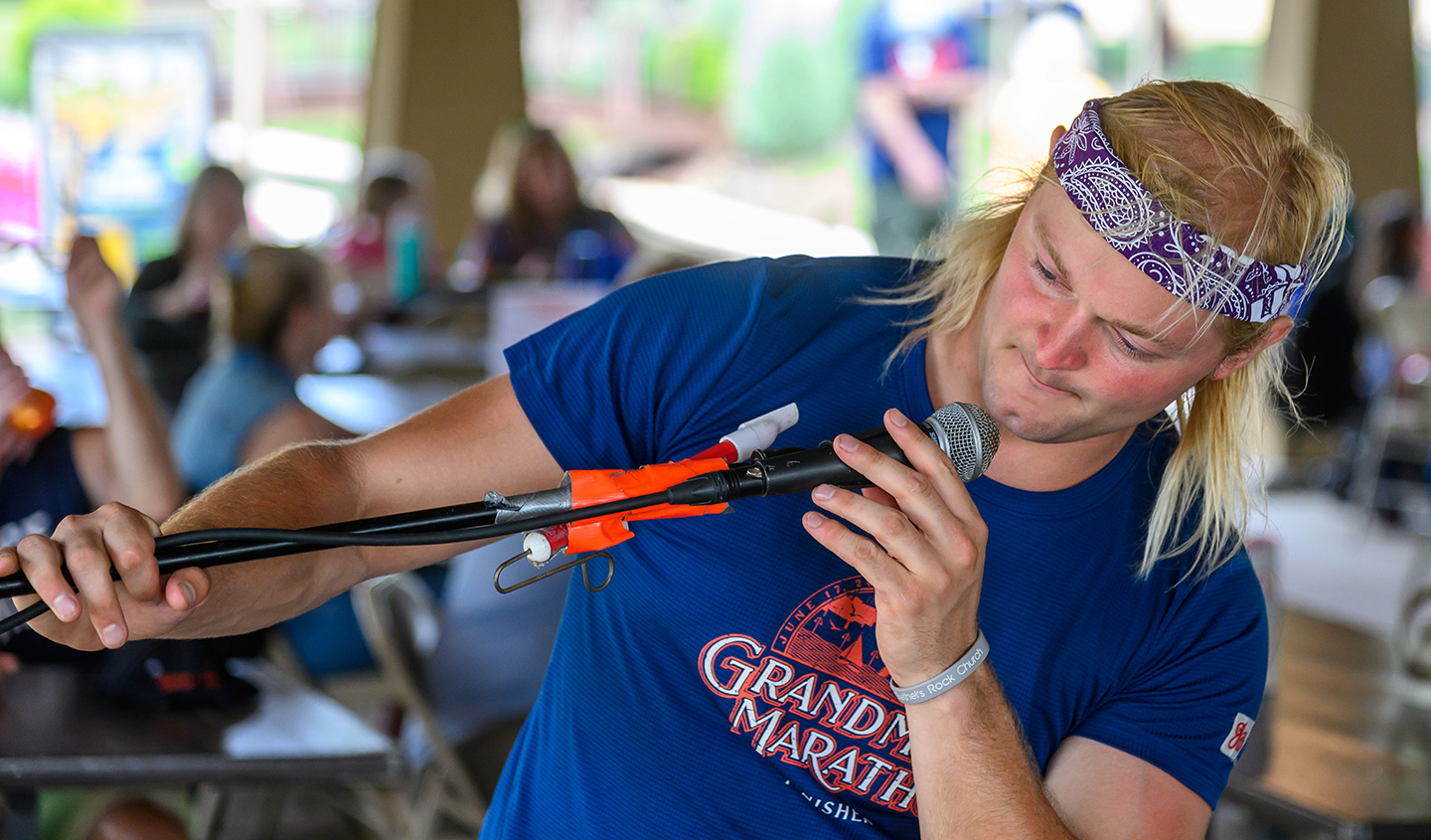 Steve Solkela checks his microphone.